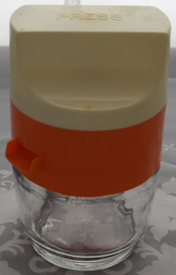 Orange and white plastic on glass Gemco 3 piece juicer