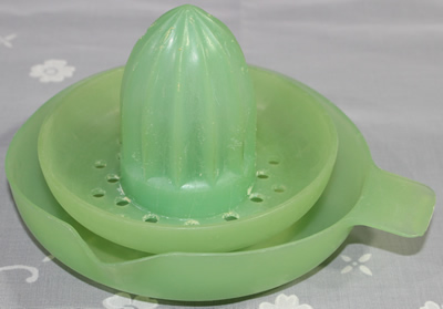 An Australian green plastic 2 piece juicer
