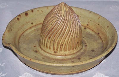 Speckled light tan pottery juicer