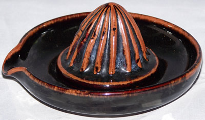 Brown with tan highlights pottery juicer