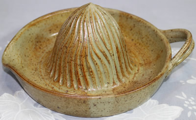 Tan with stripe loop handle pottery juicer