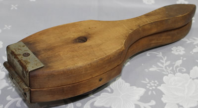 Hinged 'Lignum Vitae' hand held squeezer
