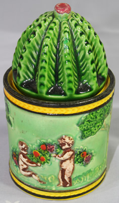 The back of a cactus top cupid ceramic jar that looks like a juicer